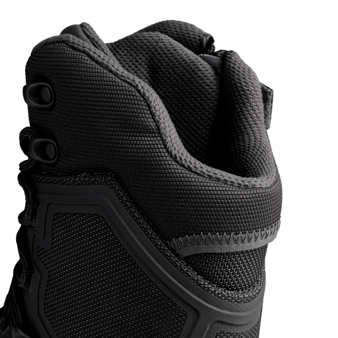 Close-up of the upper section of the Condor Brigade 8-inch Tactical Boots - Zip (Black), highlighting textured fabric, stitching, and lace eyelets against a white background.