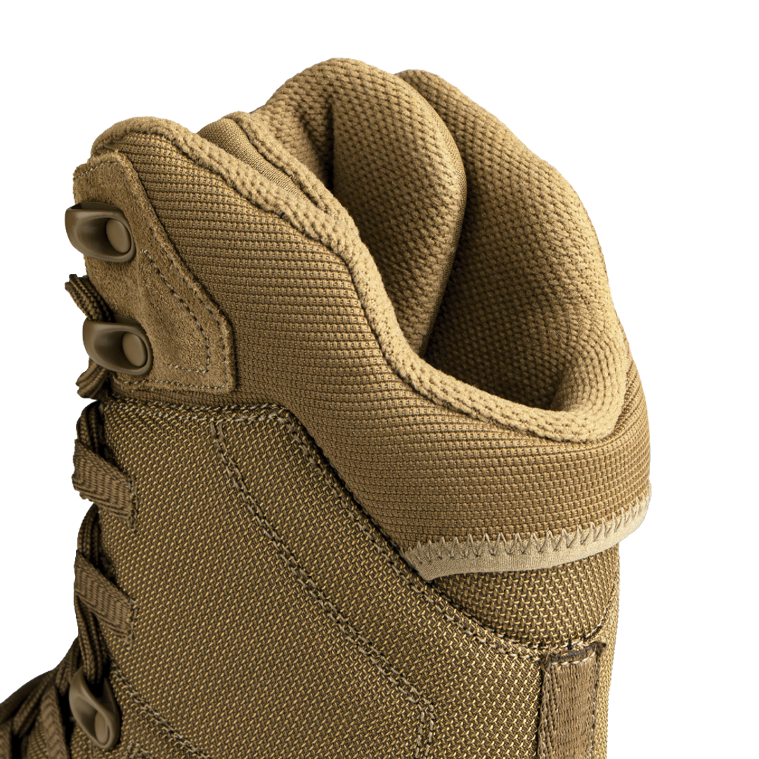 Close-up of a brown Condor tactical boot with a white background