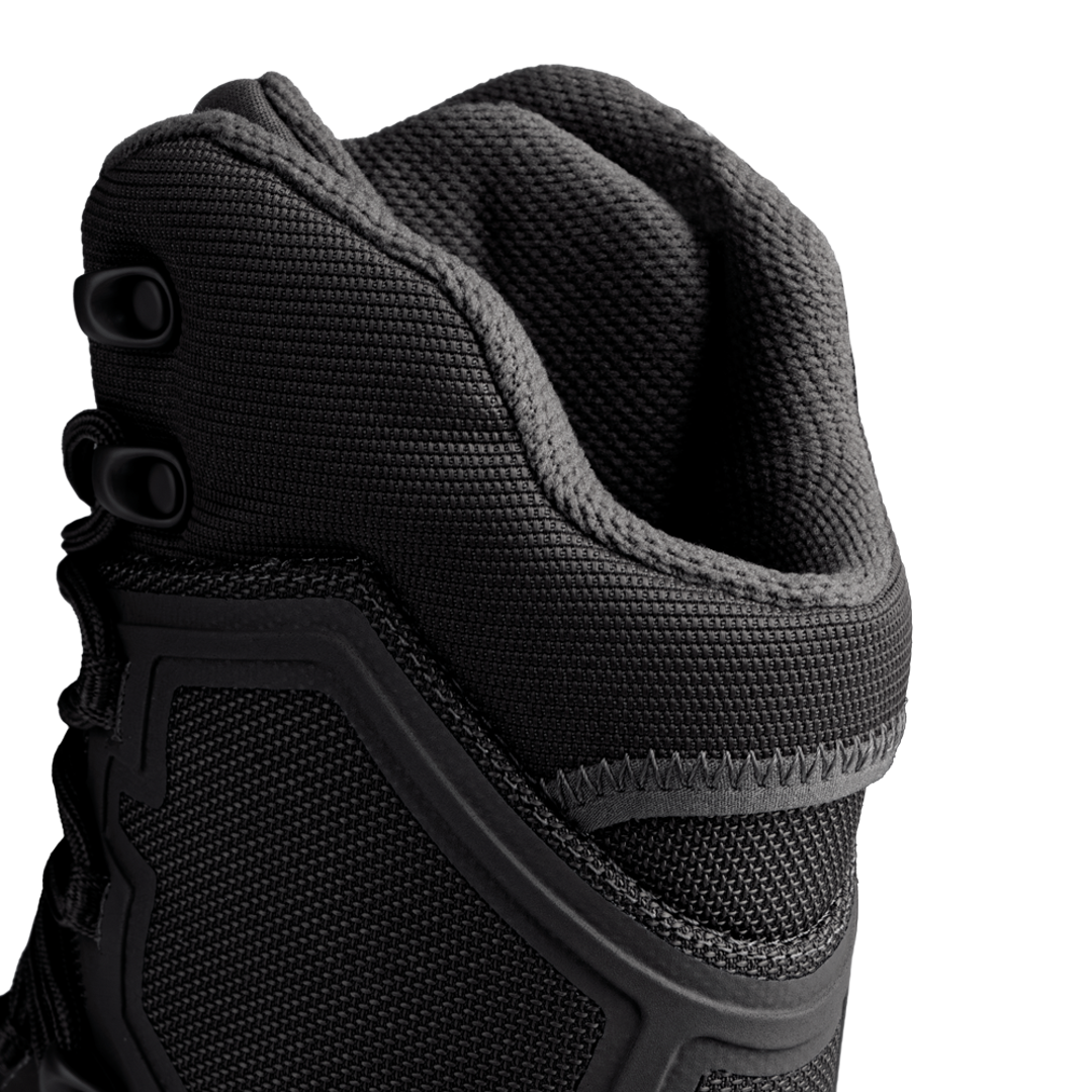 Close-up view of the upper portion of Condor Brigade 8-inch Tactical Boots in black, highlighting the textured fabric, stitching, and lace eyelets against a plain background.