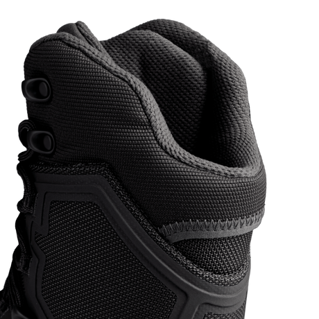 Close-up view of the upper portion of Condor Brigade 8-inch Tactical Boots in black, highlighting the textured fabric, stitching, and lace eyelets against a plain background.
