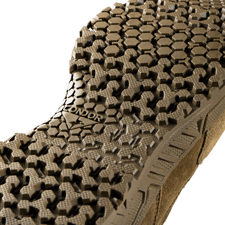 Close-up of the Brigade 8-inch Tactical Boots - Zip (Coyote Brown) by Condor, showing a brown sole with a rugged, multi-textured tread pattern and the Condor brand name in raised letters.