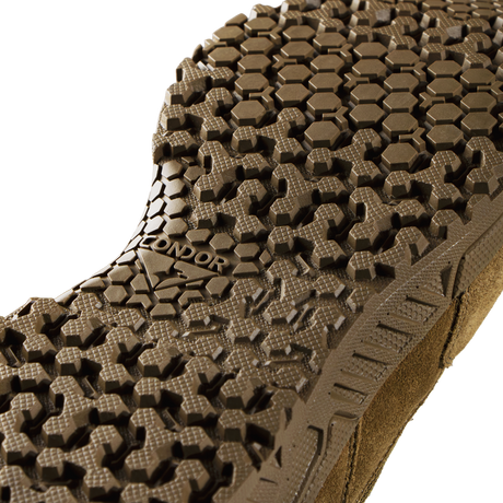 Close-up view of the Condor Brigade 8-inch Tactical Boots - AR670 outsole, featuring a brown finish and detailed hexagonal tread; "CONDOR" is visible on the sole.