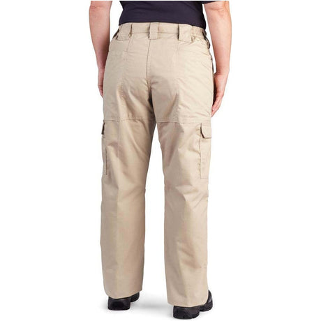 A person shown from the back wearing khaki cargo pants with a dark navy top and black shoes, photographed against a plain white studio background.