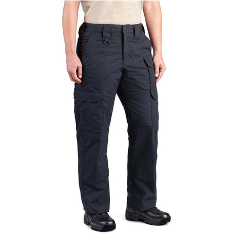 A person wearing dark navy cargo pants with multiple flap pockets, shown from the waist down against a plain white background.