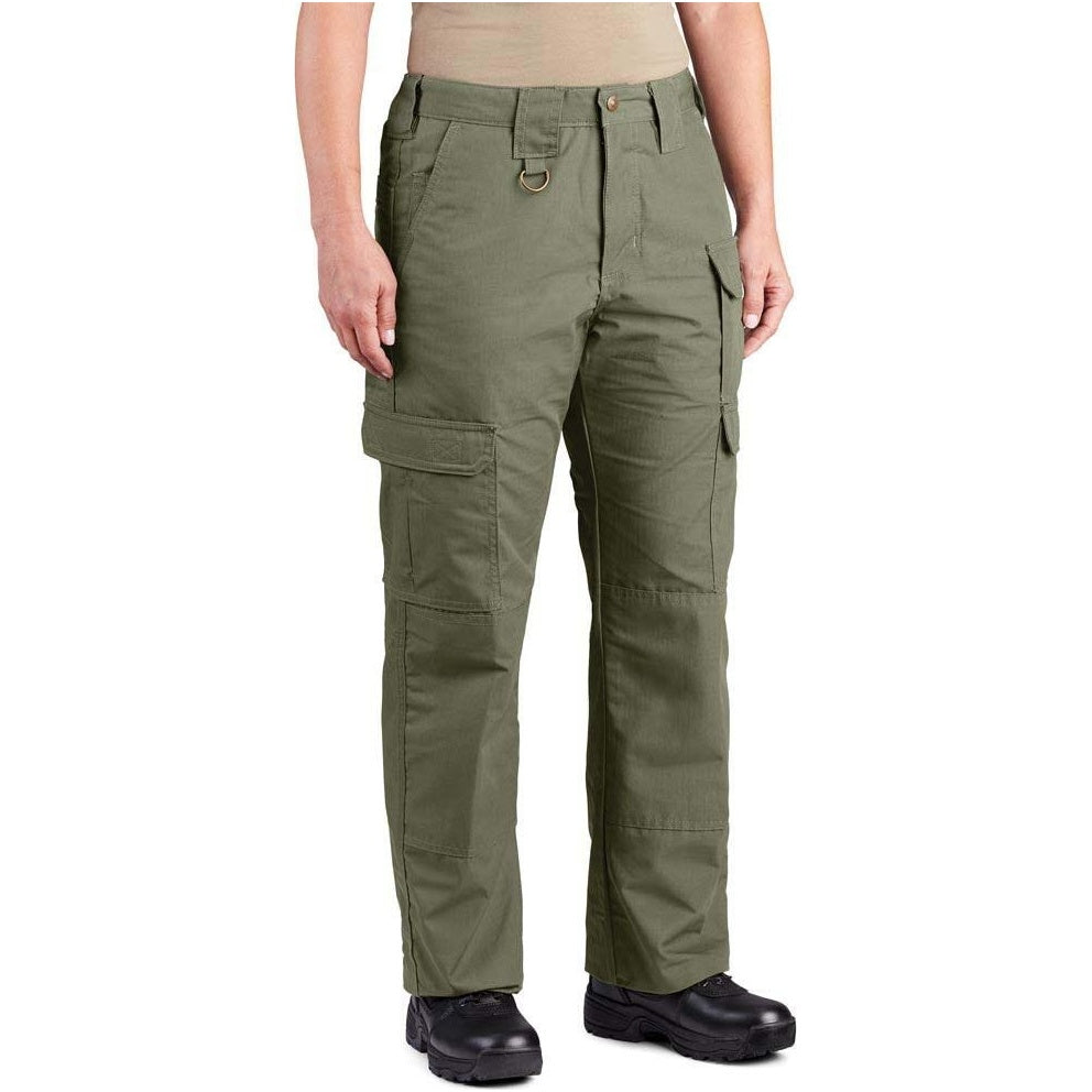 A person wearing olive green cargo pants with black work boots and a tan top, shown from the waist down on a plain white background.